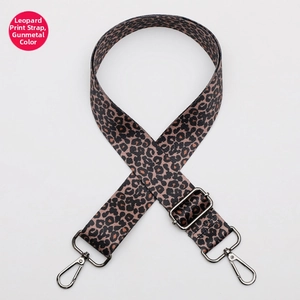 Detail of leopard print wide bag strap with gunmetal hardware and adjustable buckle
