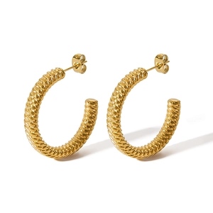Close-up of 18k gold plated stainless steel C-shaped earrings with rope texture details