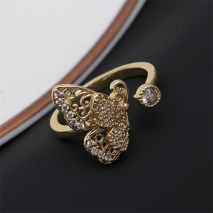 Adjustable gold plated butterfly ring featuring micro-pave white cubic zirconia accents