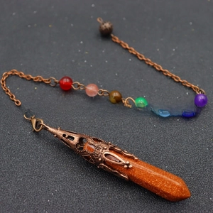 Detailed close-up of a bronze hexagonal crystal pendant with seven colorful chakra beads