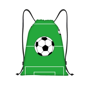 Detail of soccer field drawstring backpack with green grass print and football pattern