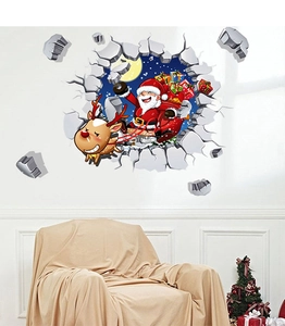3D Christmas wall sticker with Santa and reindeer on a living room wall near a sofa