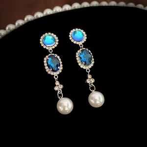 Vintage oval pearl tassel earrings with blue gemstone and rhinestones in gold finish