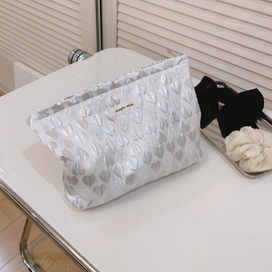 Minimalist jacquard heart cosmetic bag in silver white with Simple Wish label
