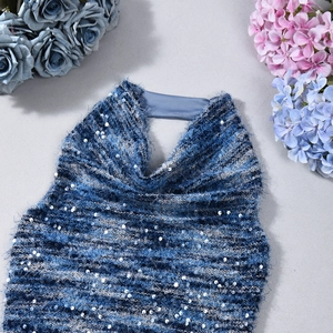 Detail of blue sequined halter top featuring shimmering silver sequins and knit texture