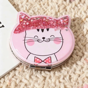 Portable pink round folding mirror featuring a cute cartoon cat with glitter sand decoration
