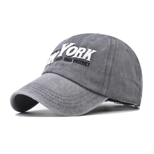 Close-up of white 3D NEW YORK embroidery on gray washed cotton vintage baseball cap
