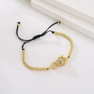 18K gold plated copper leopard head bead bracelet with green eyes and adjustable cord