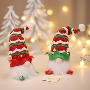 Charming LED lighted Christmas gnomes with knit hats and golden bells for holiday decor