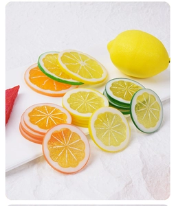 Macro view of lifelike PVC lemon slices with realistic pulp texture and vibrant colors