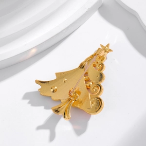 Back view of gold Christmas tree brooch showing the metal structure and pin fastener