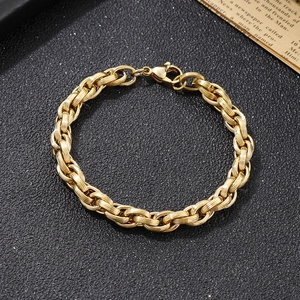 Macro view of golden stainless steel square double-link chain bracelet with lobster clasp