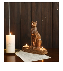 Detailed view of Bastet cat goddess candle holder with ancient Egyptian carvings