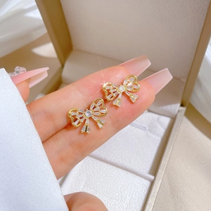 Elegant gold butterfly earrings with micro-inlaid crystals for a luxury evening look