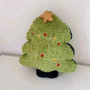 Close-up of plush Christmas tree pillow with soft textures and decorative star