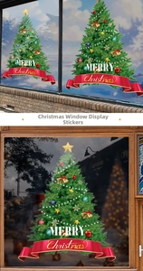 Close-up of green Christmas tree window sticker with golden stars and Merry Christmas text