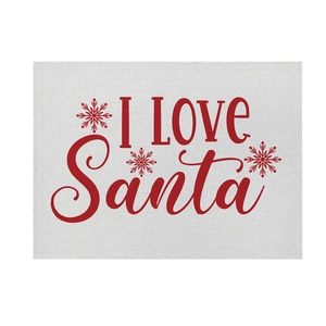 Detail of Christmas cotton linen placemat with red I LOVE Santa print and snowflake pattern