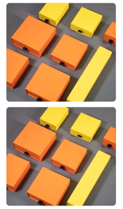 Detail of square and long drawer gift boxes in vibrant orange and yellow with ribbon pulls