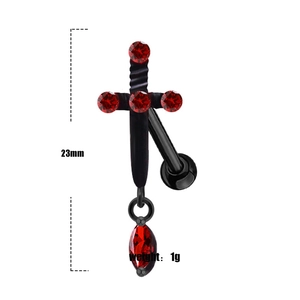 Macro detail of 23mm gothic bat cross belly ring with red zircon inlay in black metal