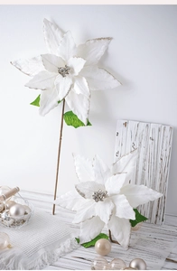 Detail of white Christmas poinsettia with silver glitter edges and sparkling sequins