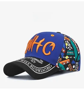 Detail of baseball cap showing blue crown with 3D HC embroidery and ethnic print side