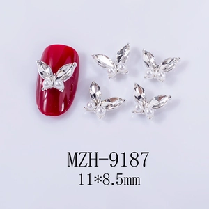 Detail of 11x8.5mm silver alloy butterfly nail charm with rhinestones and pearls