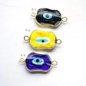 Three colorful enamel evil eye jewelry connectors in gold finish for DIY crafts