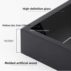 Detail view of the 5cm deep hollow black frame showing 6cm total thickness and glass panel