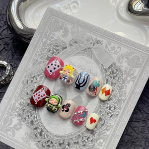 Dark princess style circus press-on nails set with red poker motifs and cute 3D charms