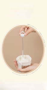 Detail of extracting a flexible metal straw cleaner with a ring handle from a cup brush