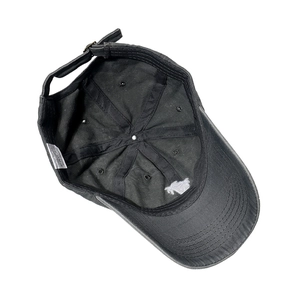 Detail of the 100% cotton inner lining and palm tree embroidery on black denim cap