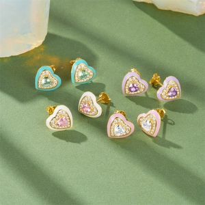 Macro view of heart-shaped enamel stud earrings with micro-set zircon and colorful stones