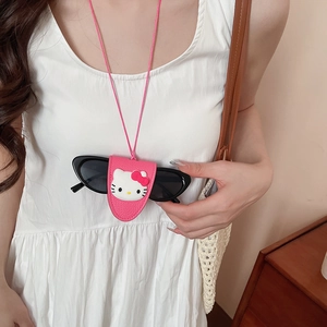 Detailed view of Hello Kitty pink leather glasses holder necklace with cat eye sunglasses