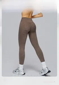 Detail of high waist yoga leggings in brown marl knit with body shaping fit