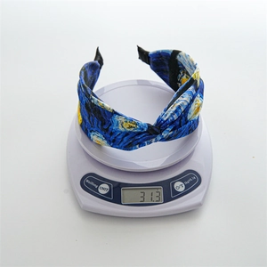 Starry Night print headband weighing 31.3g on a digital scale for material check