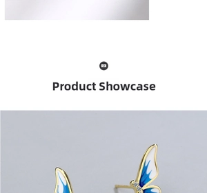 Macro shot of blue gradient enamel butterfly earrings with gold plating and crystals