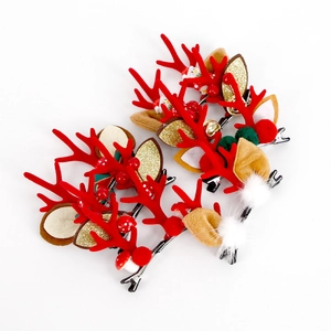 Christmas reindeer antler hair clips with bells and plush balls for festive hair accessories