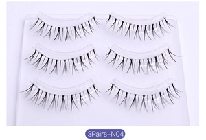 Detailed view of 3 pairs of N04 tapered false eyelashes with a transparent band on tray