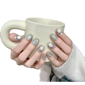 Handmade sage green cat-eye press-on nails with white daisy floral art design
