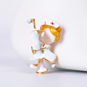 Detail of cartoon nurse brooch with opal head and syringe medical accessory