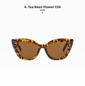 Detail view of tortoiseshell cat eye sunglasses with metal rivets in color DEMI