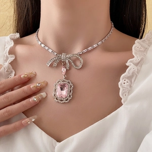 Elegant silver bow necklace with pink rectangular zircon and sparkling diamond accents