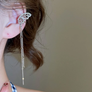 Detail of silver butterfly ear cuff with sparkling zircon fringe tassels on model