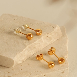 Minimalist golden irregular sphere stud earrings with metal and silicone backings