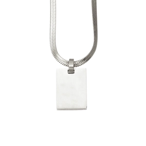 Detail of minimalist stainless steel rectangle pendant with sleek silver snake chain