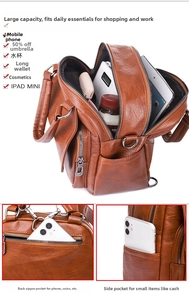 Detalle de la gran capacidad y múltiples bolsillos de esta mochila de viaje de cuero marrón