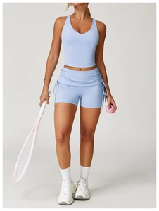 Detail of light blue racerback yoga tank top with V-neckline and high-stretch fabric