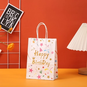 Colorful white kraft paper birthday gift bag with golden Happy Birthday text and balloons