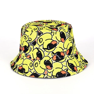 Detail view of yellow bucket hat featuring repeated cartoon duck patterns and stitching