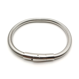 Close-up of polished stainless steel snake chain bracelet with industrial cylindrical clasp
